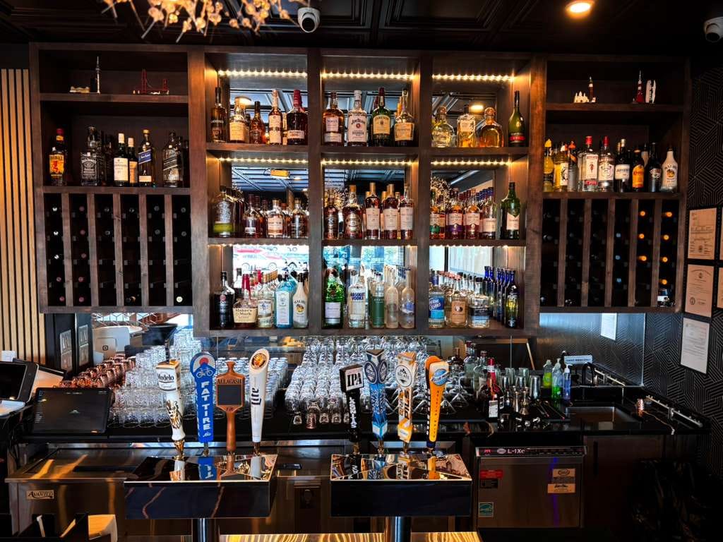 Full bar with backlit spirits wall and tap handles